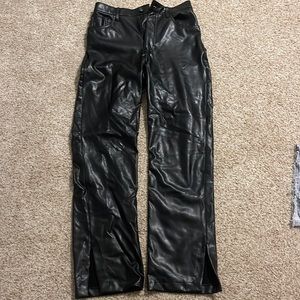 Black Abercrombie leather pants with hem slit.